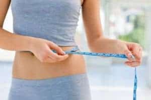 Choco Lite (reviews, effects, how to use) - how does the chocolate weight loss shake work and is it worth the price? 2 a woman measures her waist circumference