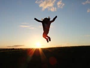  woman jumping in the sun