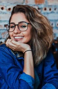 Happy Smile - a beautiful smile with cosmetic tooth implants 2 smiling woman