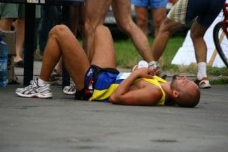  A tired athlete lies on the ground