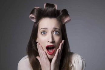  A frightened woman with rollers on her head