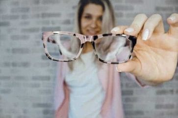 Vison - eliminates the causes of visual impairment and improves vision 2 woman keeps glasses