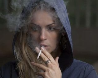 Nicotine Free - stop smoking quickly and effectively without withdrawal syndrome effects 2 woman smoking a cigarette