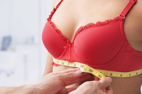 Boom Breast - non-invasive breast enhancement reviews 2 female breasts measured with a centimeter