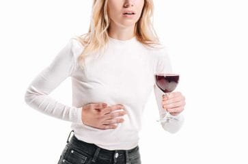 Woman with a glass and liver pain