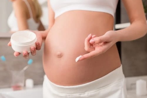  a pregnant woman should apply a cream to her belly