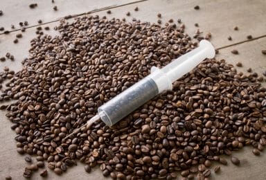  coffee beans in a syringe