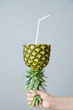 Bromelain - get healthy and lose weight with the pineapple fruit 4 Pineapple with a straw
