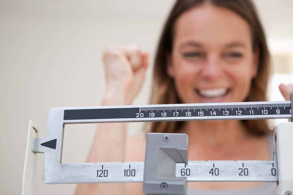  woman checks her weight